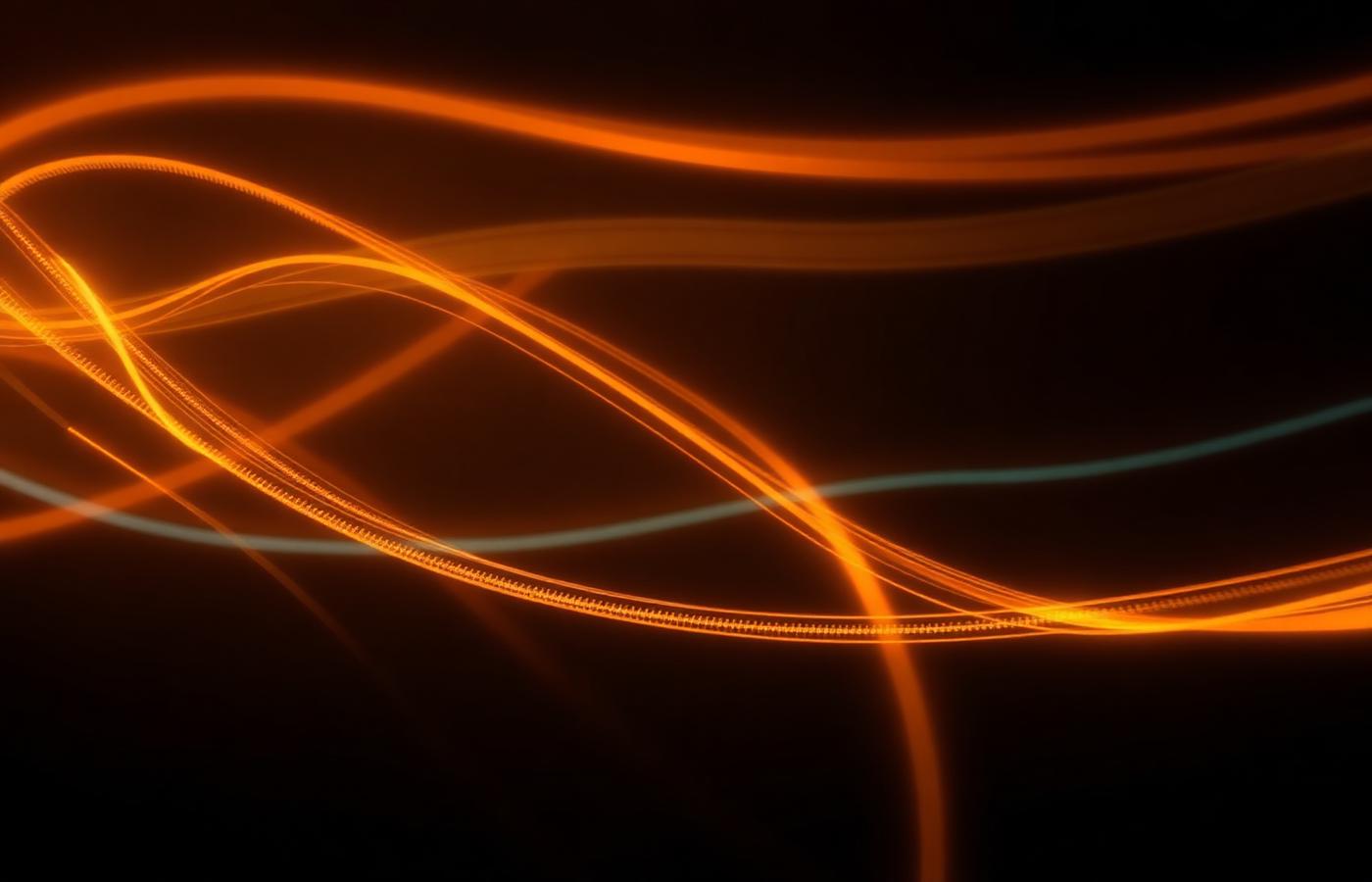 Long-exposure amber light streams over a dark background suggesting data flow